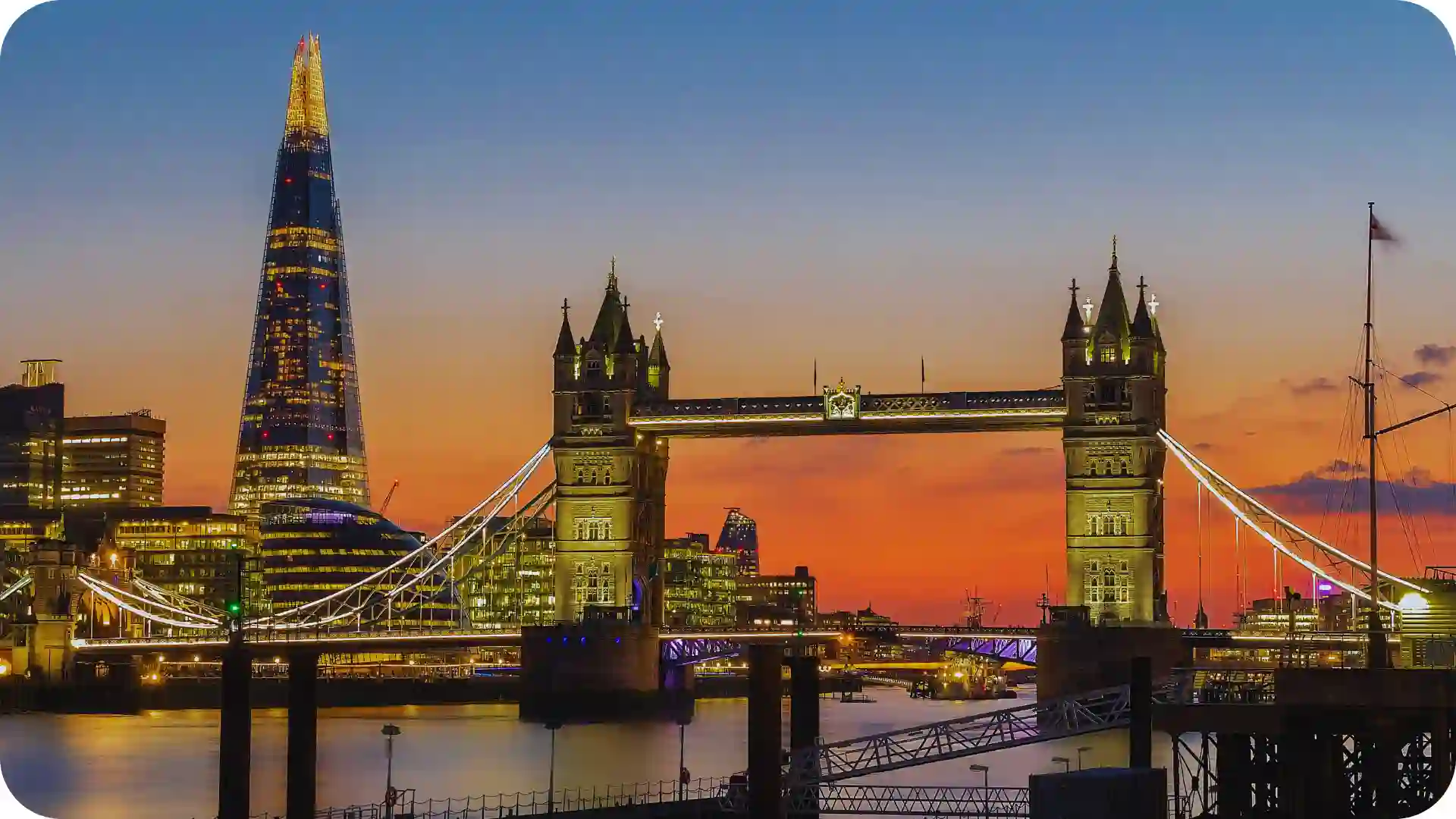 London Tower Bridge and The Shard at sunset, illuminated skyline over the River Thames – Ghumora Europe city break